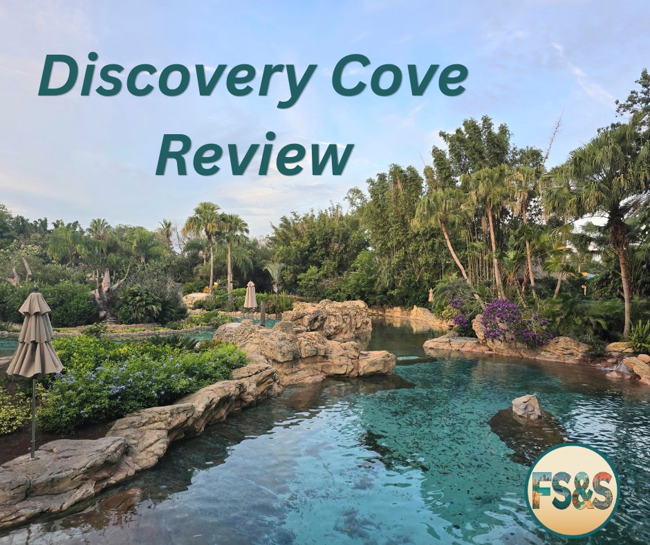 Discovery Cove review photo of a tropical lagoon and palms.